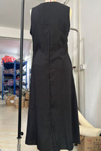 Women's sleeveless button-down midi dress by Trendsi, elegant A-line casual wear with a flattering fit and classic design.