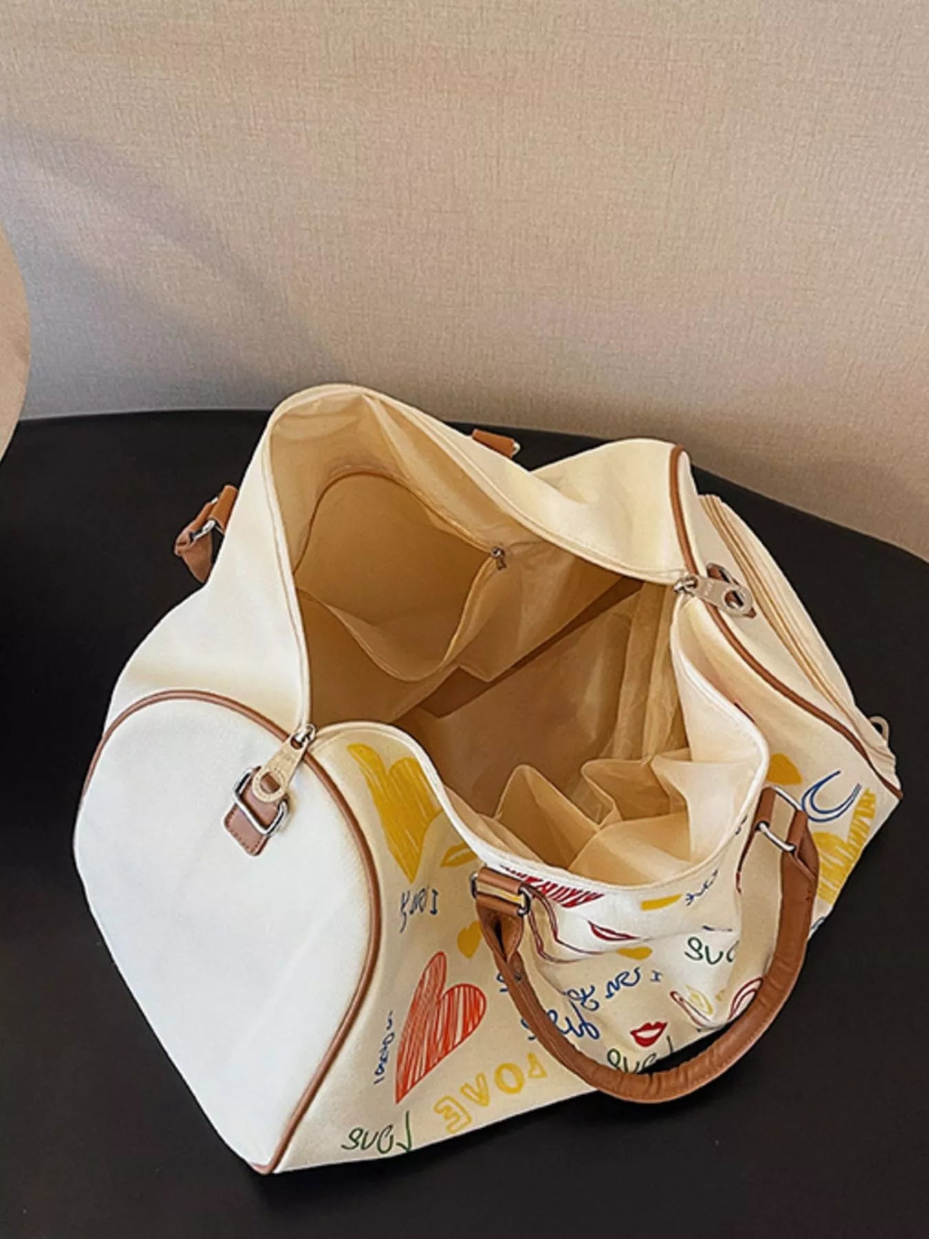 Printed duffel bag with adjustable strap from Shopimist, featuring a spacious design and durable handles for travel or gym use.