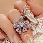 Zircon bow pendant necklace by Shopimist featuring a sparkling zircon stone on a delicate chain, close-up view of the jewelry.
