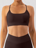 Trendsi spaghetti strap active bra in black, lightweight sportswear with thin straps and supportive design.