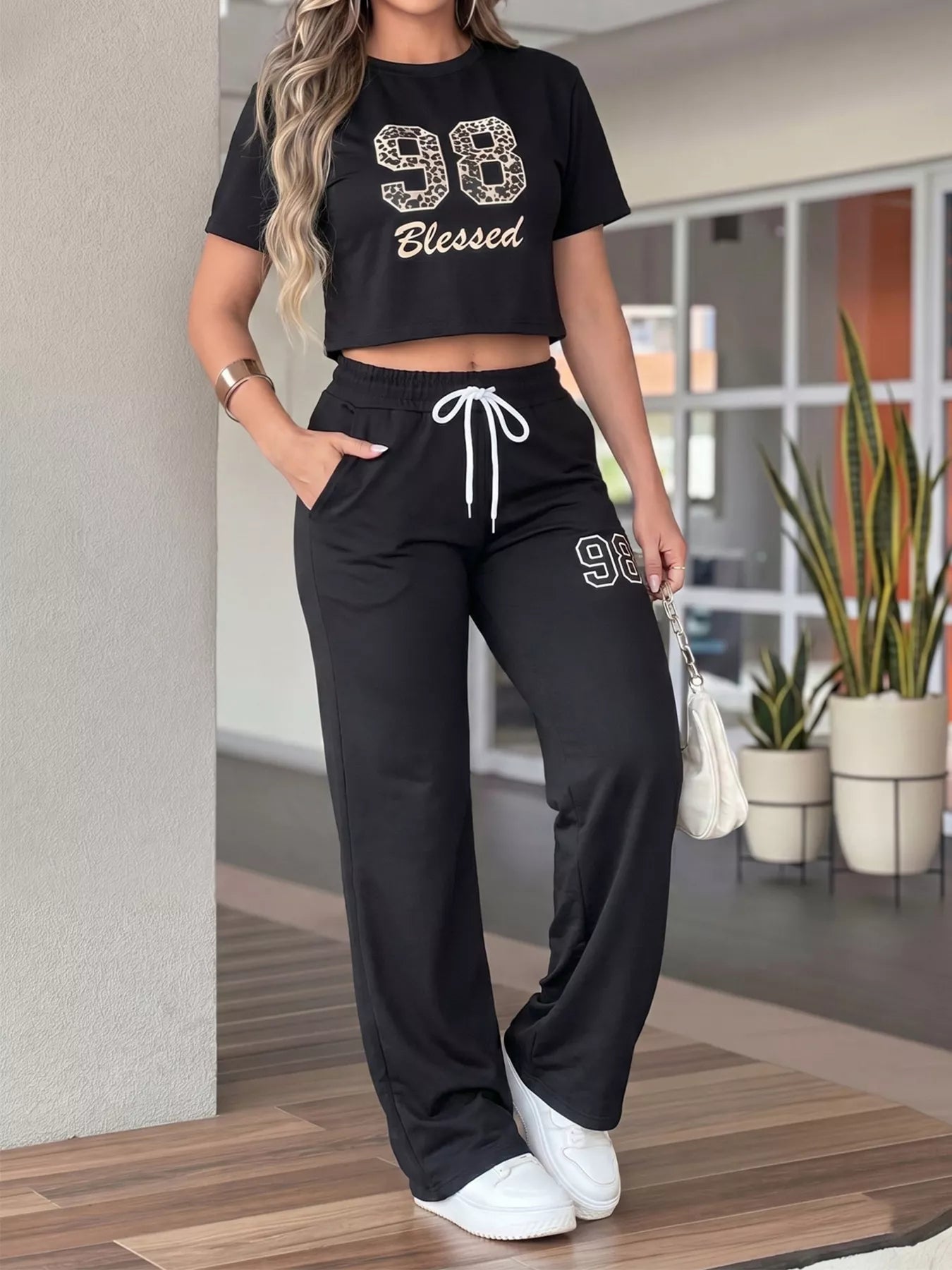Leopard print crop top and wide-leg pants set by Plush Fashion Hub, stylish two-piece outfit with bold animal print.