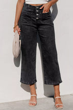 High-waisted button-fly wide-leg jeans by Trendsi displayed on a model, showcasing the relaxed fit and stylish denim.