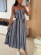 Women's striped tie-shoulder midi dress by Trendsi featuring casual summer style, perfect for brunch or warm-weather outings.