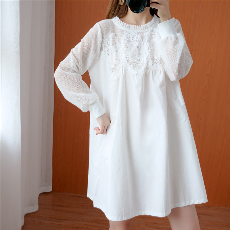 White lace-trimmed tunic dress in cotton with long mesh sleeves, round neck, and pleated details.