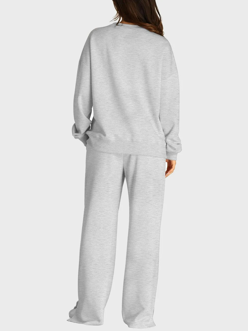 Trendsi round neck long sleeve top with slit pants set, featuring a stylish coordinated outfit in neutral tones.