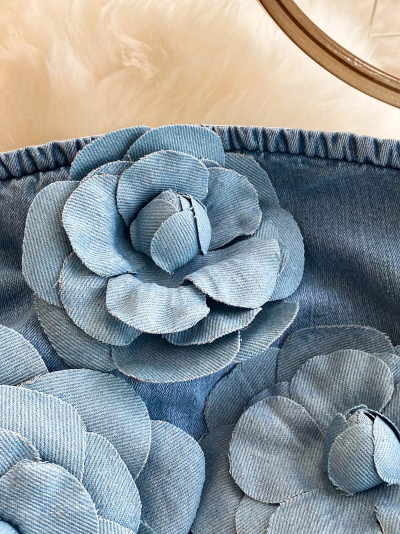 Floral applique strapless denim dress from Trendsi featuring a fitted bodice and decorative floral details.