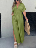 Plus size maxi dress with slit V-neck, smocked waist, and flowy fabric, designed by Trendsi.