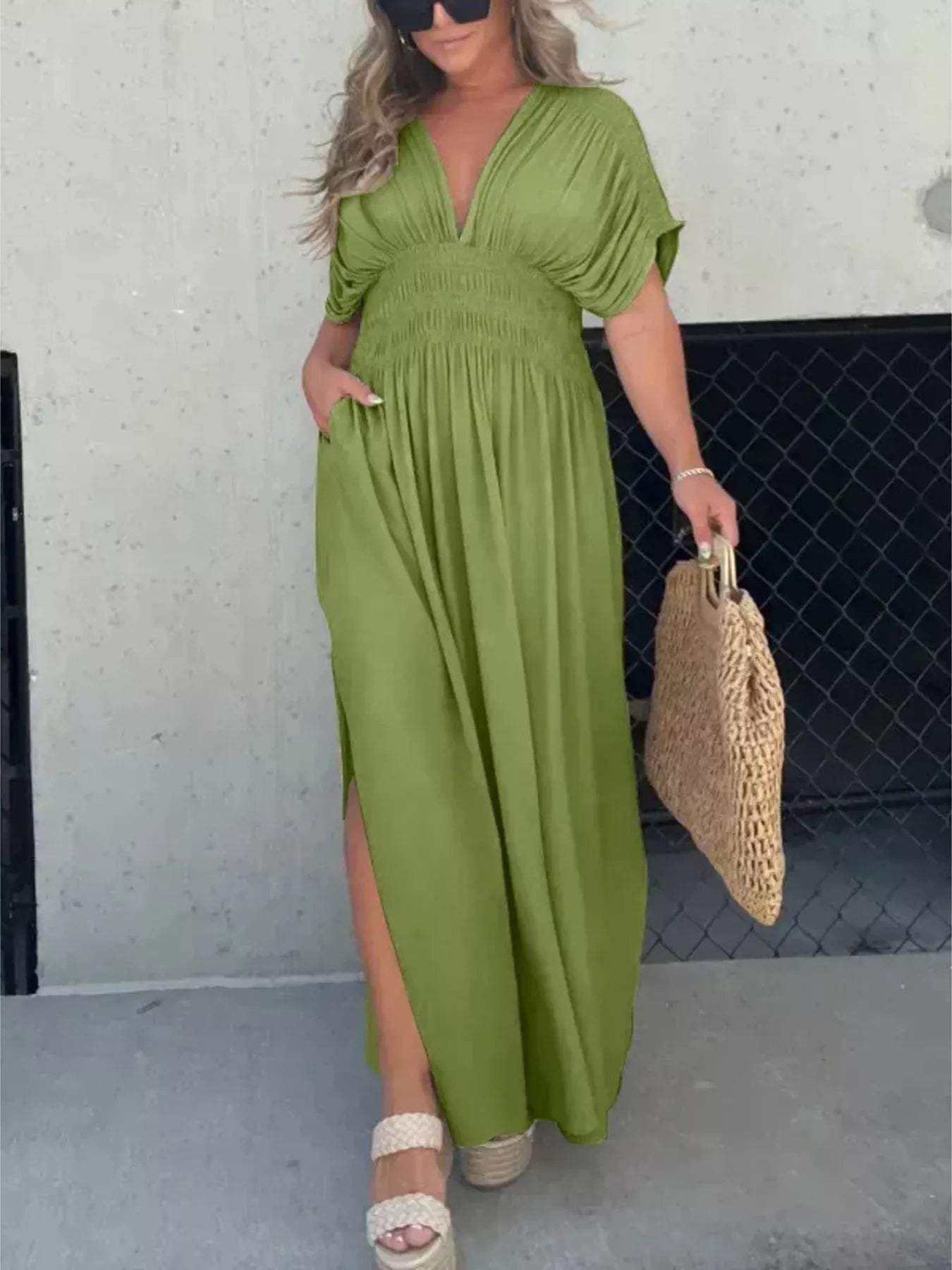 Plus size maxi dress with slit V-neck, smocked waist, and flowy fabric, designed by Trendsi.
