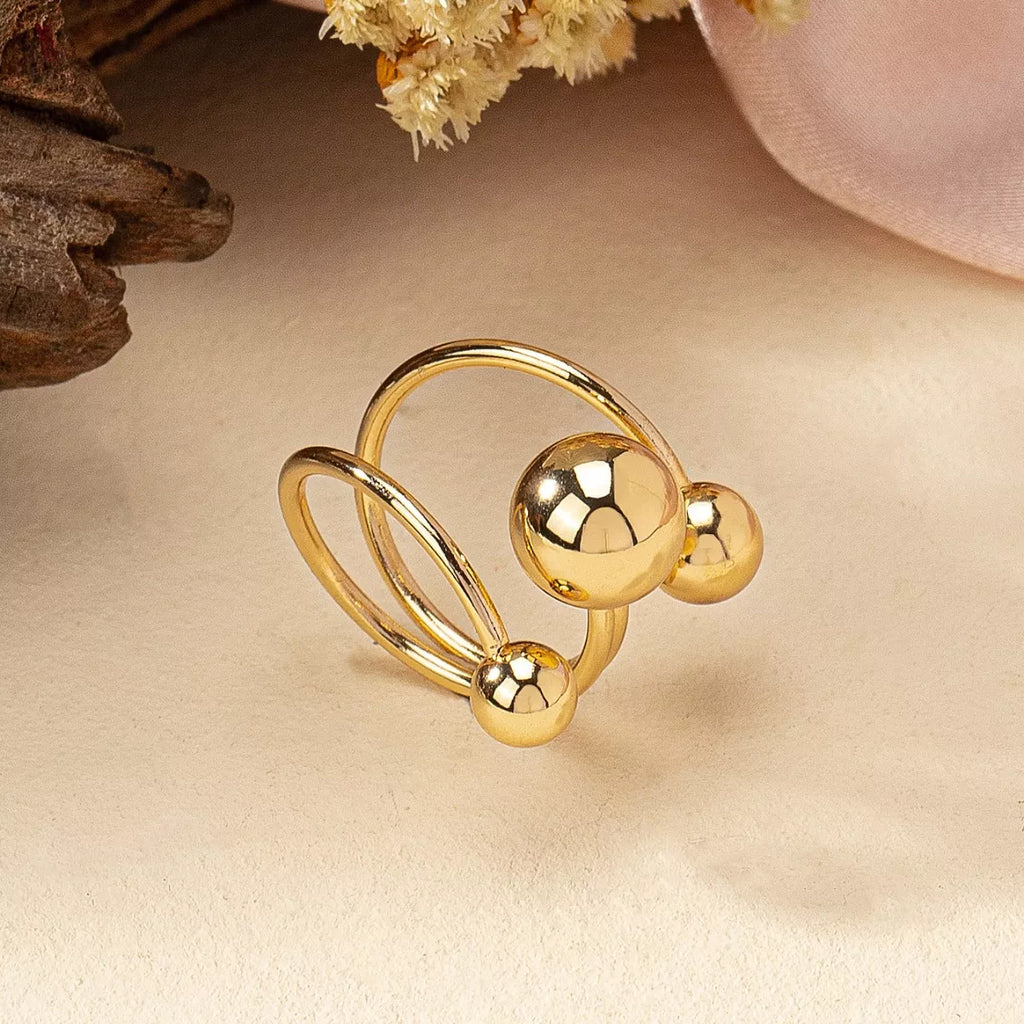 Multi-layered ball ring by Shopimist featuring stacked silver bands with small ball accents on a white background.