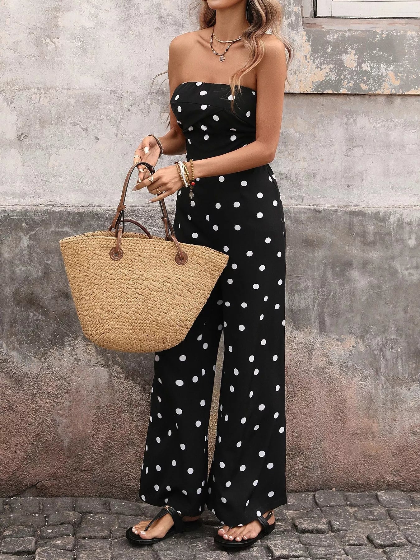 Polka dot strapless wide-leg jumpsuit by Plush Fashion Hub featuring a chic, stylish design and a comfortable fit.