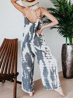 Plus size tie-dye wide leg jumpsuit by Shopimist featuring vibrant colors and flowing fabric, full-length and stylish for casual wear.