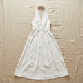 Women's sleeveless halter neck maxi dress by FitiqueFit featuring an A-line silhouette and high waist design.