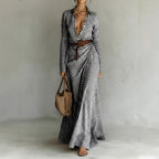 Women's belted irregular pleated dress by Plush Fashion Hub displayed with a flowing fabric and stylish belt detail.