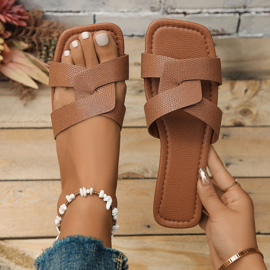 Plush Fashion Hub crisscross strap open toe flat sandals with stylish design and comfortable fit, perfect for casual summer wear.