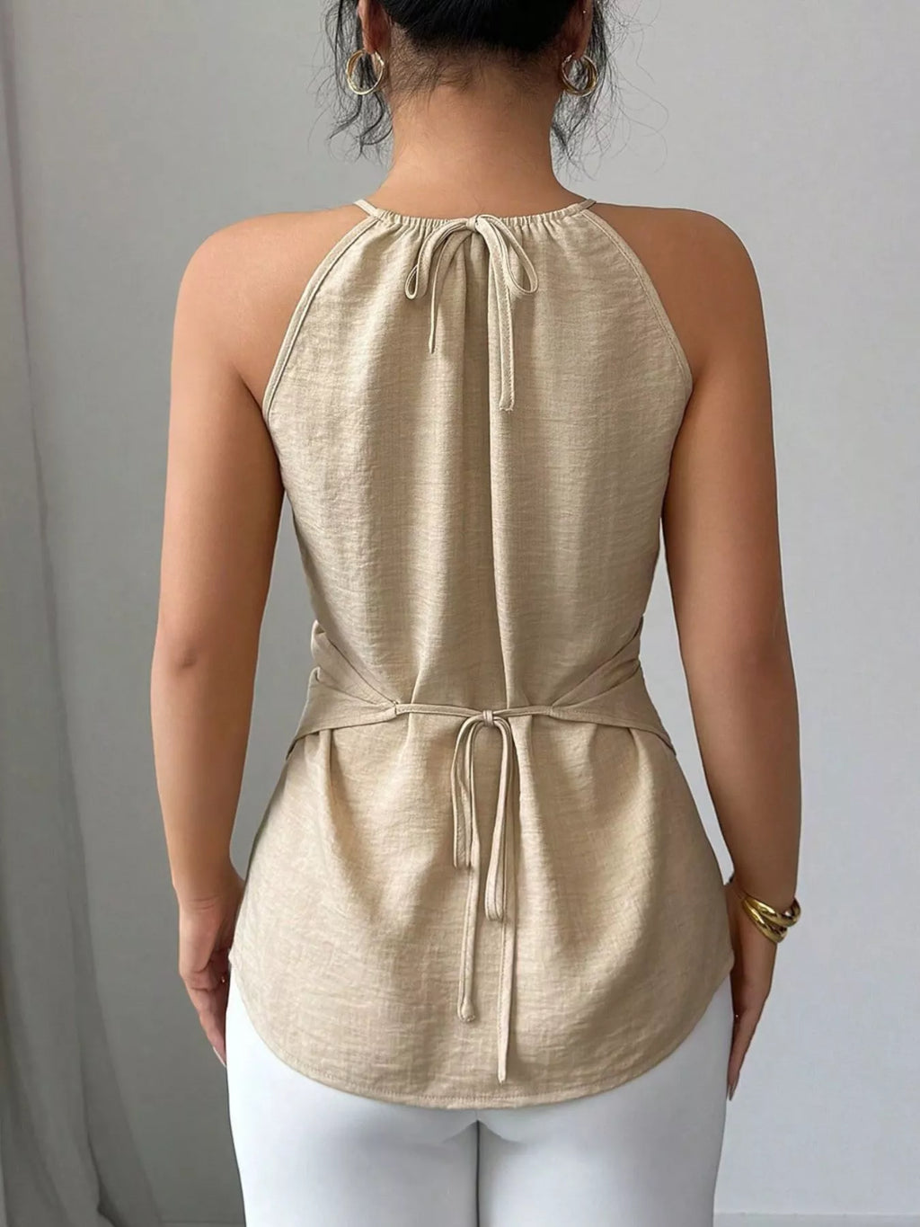 Plush Fashion Hub halter neck crisscross cami tank top in black, featuring stylish strap design and slim fit for casual wear.