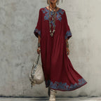 Women's printed batwing sleeve midi dress in loose fit linen blend fabric by Plush Fashion Hub, featuring a relaxed, stylish design.