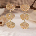Seashell dangle earrings with pearl accents, crafted by Shopimist, featuring natural seashells hanging from delicate hooks.