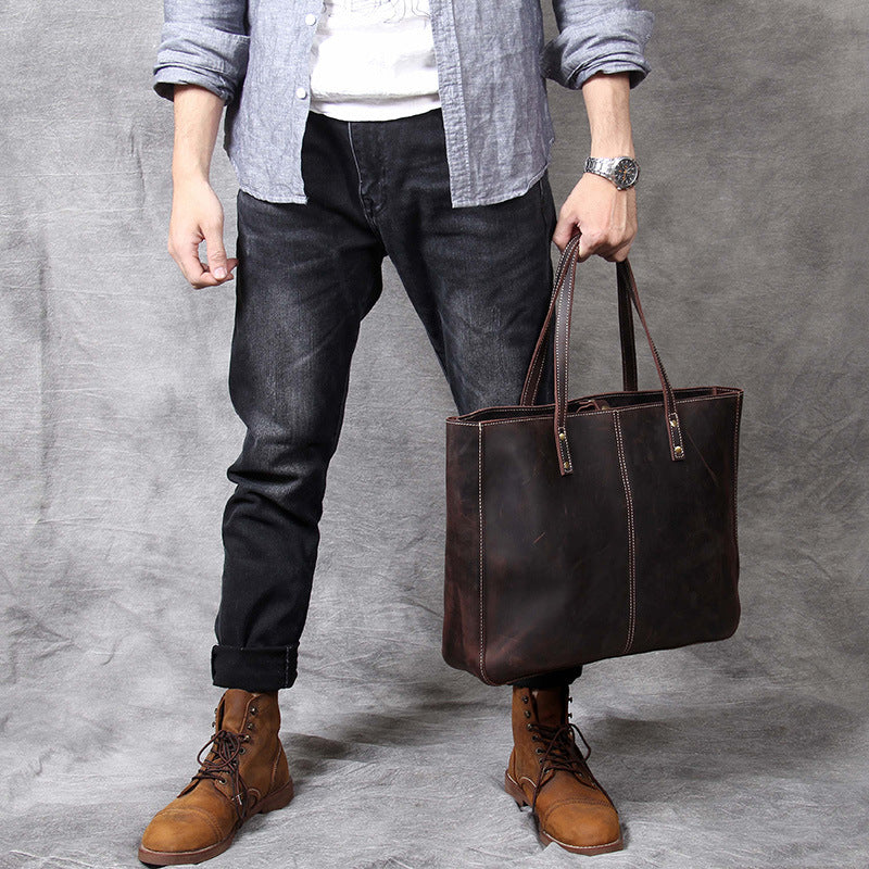 Simple retro first layer cowhide large-capacity men's handbag with a classic design and sturdy leather construction.