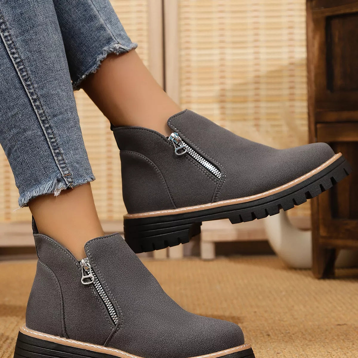 Black ankle boots with zipper accent from Trendsi, featuring a stylish design and chunky heel for versatile wear.
