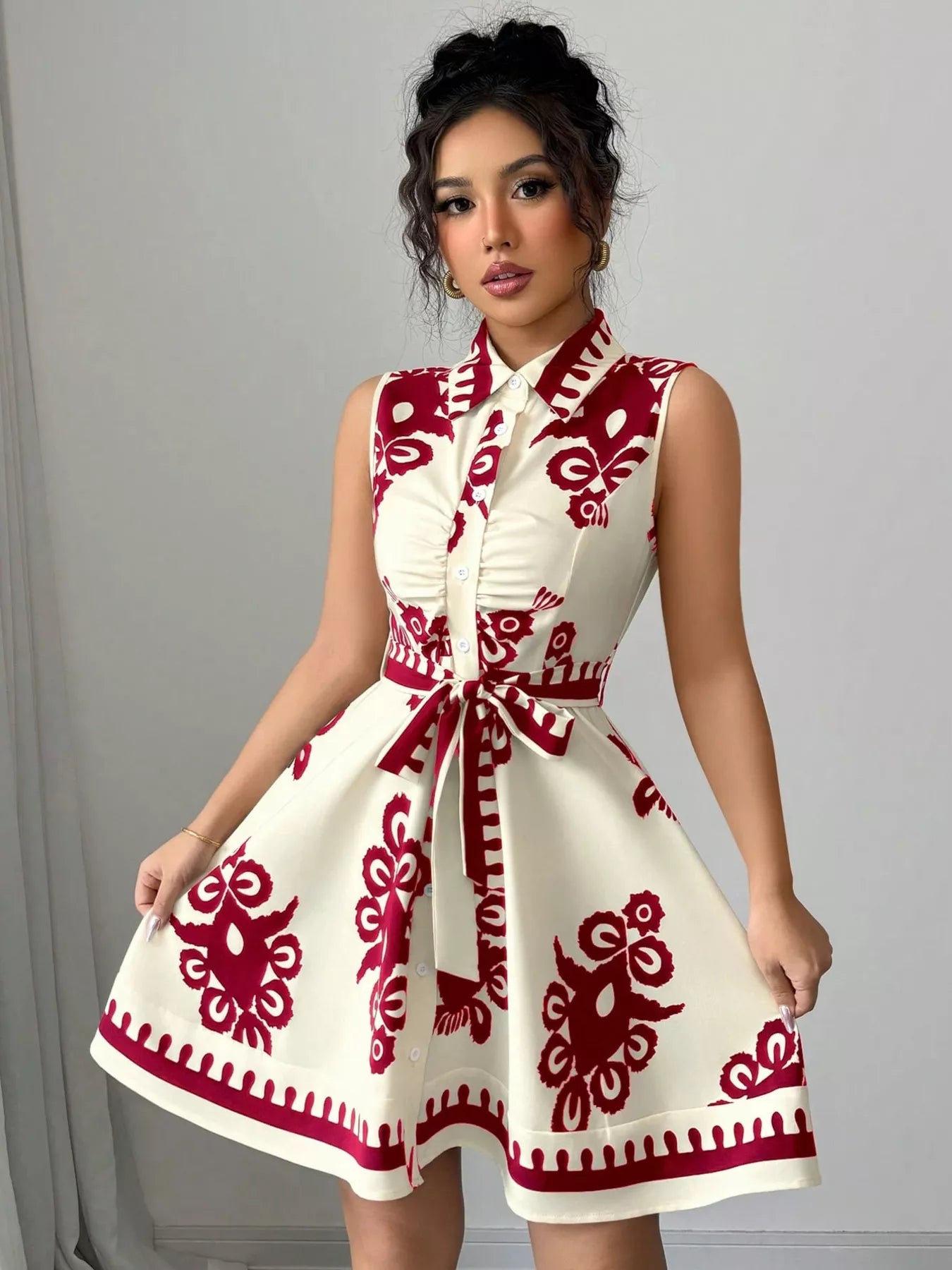 Sleeveless ruched printed tie waist dress by Plush Fashion Hub featuring a stylish design and flattering fit.