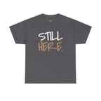 Wear Your Worship Still Here motivational T-shirt featuring mental health and resilience graphic design on a streetwear style tee.