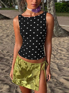 Polka dot tank top by Shopimist featuring a sleeveless design with black and white polka dot pattern on lightweight fabric.