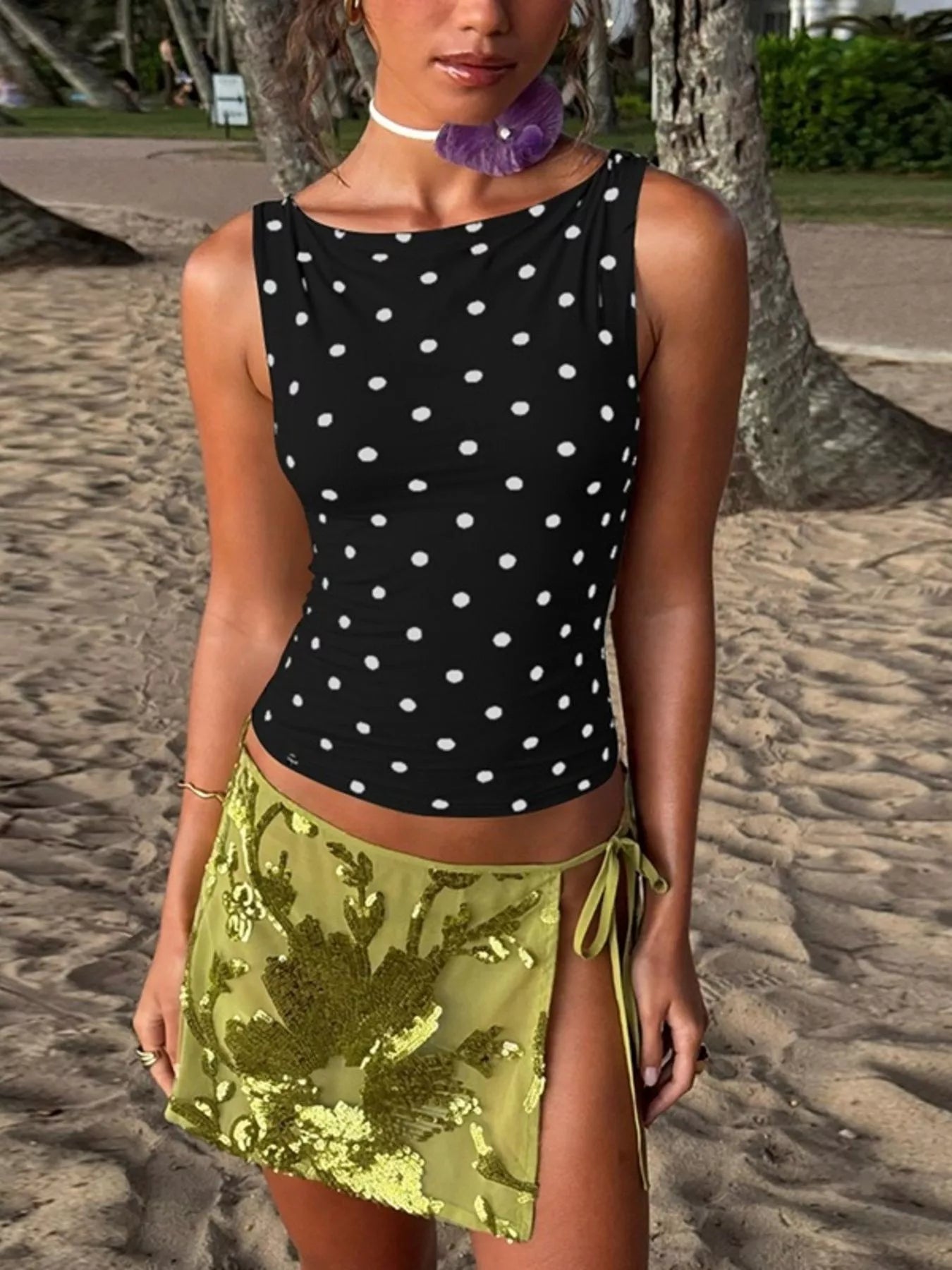 Polka dot tank top by Shopimist featuring a sleeveless design with black and white polka dot pattern on lightweight fabric.