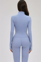 Fitglutes Activewear three-piece set with a cross back sports bra, zip jacket, and leggings for workout and gym activities.