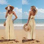 Yellow printed backless sleeveless strap jumpsuit by FitiqueFit, showcasing a stylish, casual romper with wide straps and vibrant pattern.