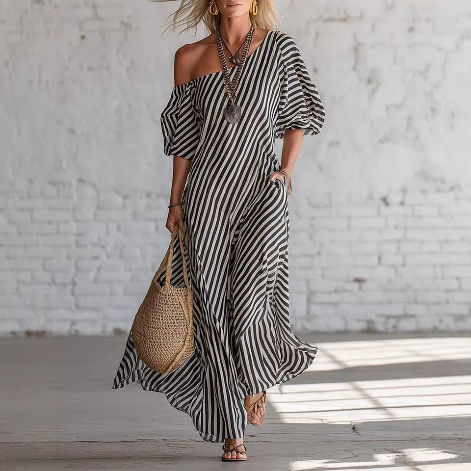 Woman wearing a stylish striped off-shoulder dress from LadyShow.Store, showcasing the dress's fit and pattern.