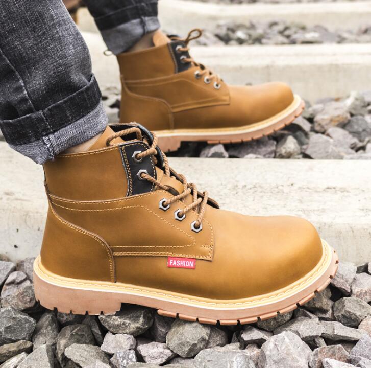 Tan nubuck leather lace-up ankle boots with thick soles, black collar panels, and "Fashion" tag.