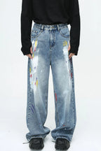 Denim painting jeans with pockets from Plush Fashion Shop, featuring a stylish distressed design and classic five-pocket style.