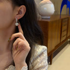Pearl hoop earrings with zircon accents from Shopimist, showcasing elegant jewelry with shiny pearls and sparkling zircon details.
