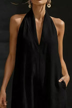 Women's sleeveless wide-leg jumpsuit with pockets, casual chic romper by Trendsi, shown in a stylish and comfortable fit.