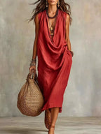 Plus size full-length cowl neck sleeveless midi dress from Trendsi, featuring a stylish design and flowing fabric.
