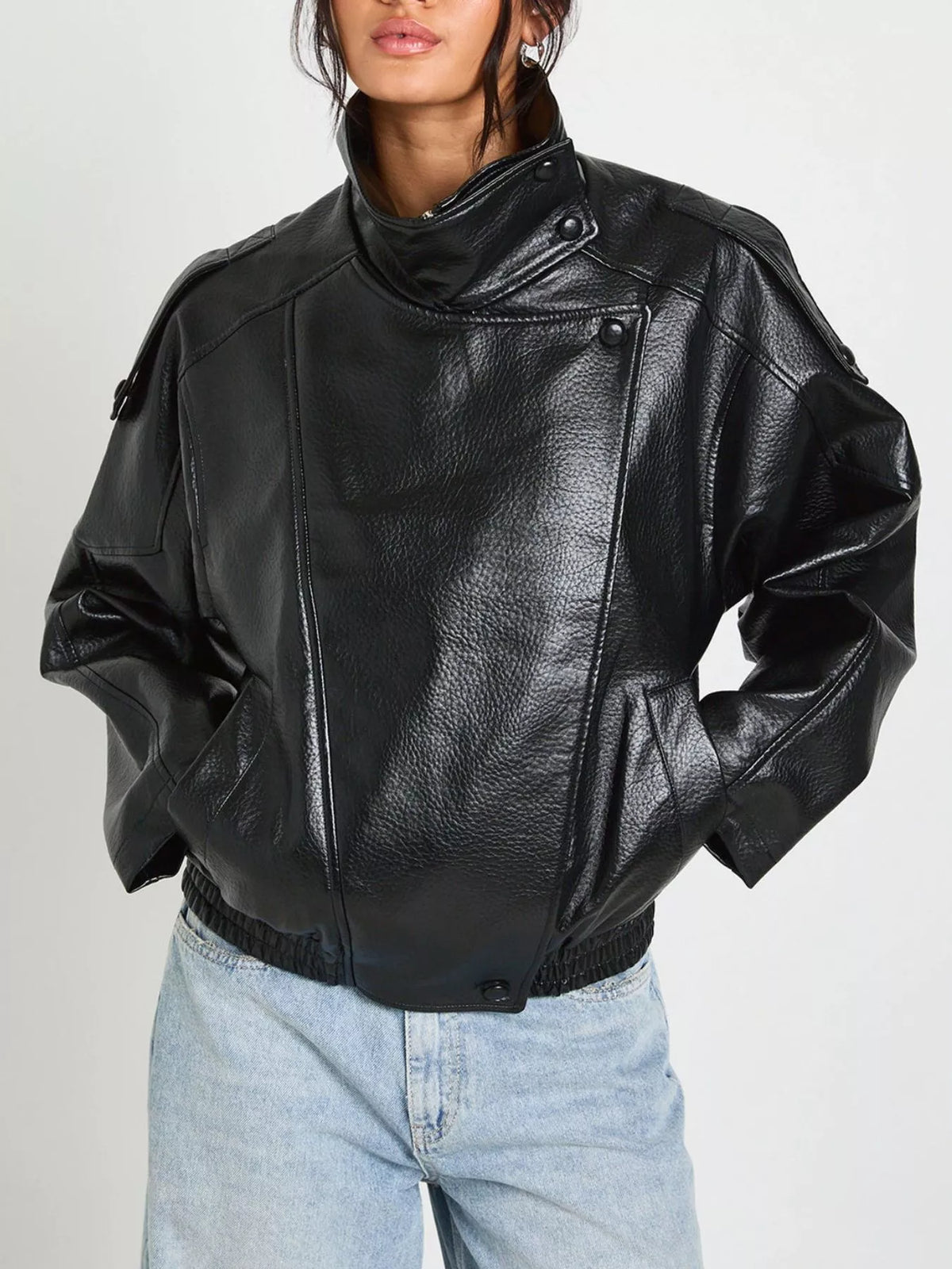 Women's faux leather moto jacket with asymmetrical zip, black trendy jacket featuring classic motorcycle style and silver hardware.