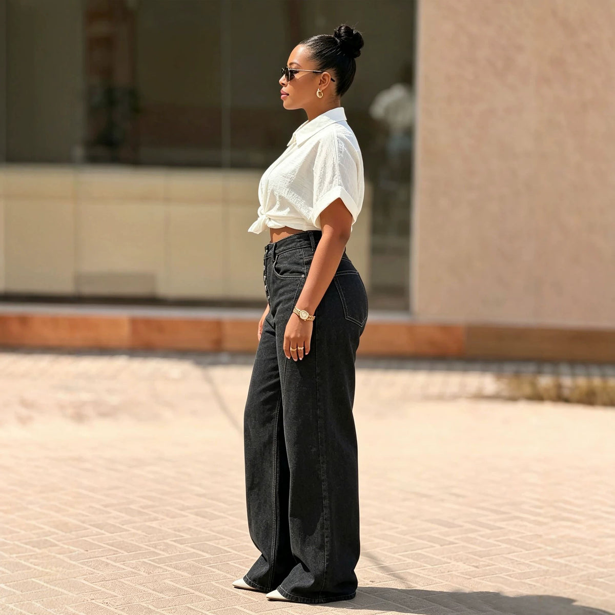 Women's black denim jeans with multi-button fly and straight leg fit from Plush Fashion Hub, shown with front view.