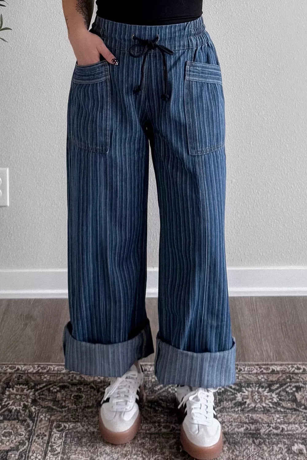 Striped wide-leg denim jeans from Plush Fashion Shop, featuring a relaxed fit and bold vertical stripe pattern.