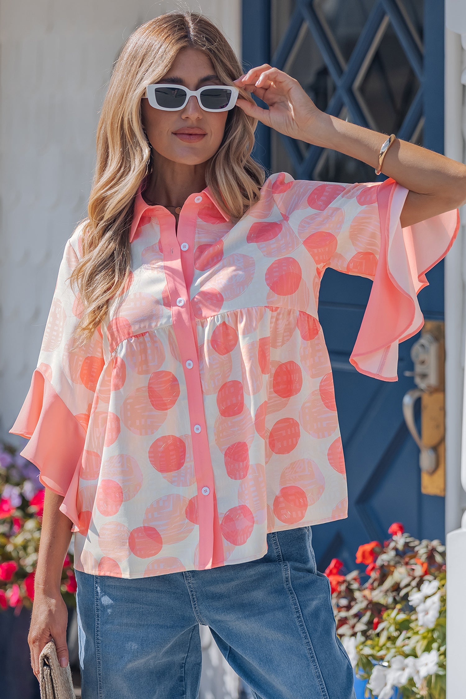 Threaded Pear Angelica short sleeve babydoll blouse with flowy fabric and floral pattern, designed for a casual, stylish look.