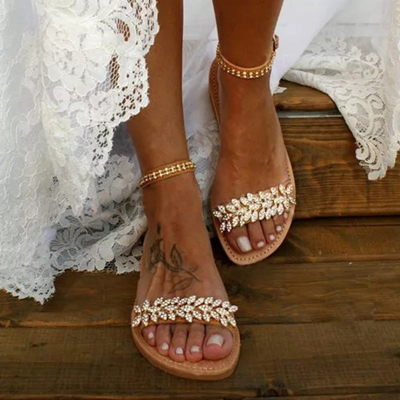 Women's rhinestone strap flat sandals with large size, featuring word buckle accents and plush fashion design.