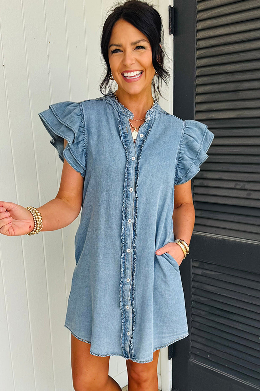 Light blue Sasha short sleeve mini dress by Threaded Pear, featuring a fitted bodice and flared skirt, displayed on a hanger.