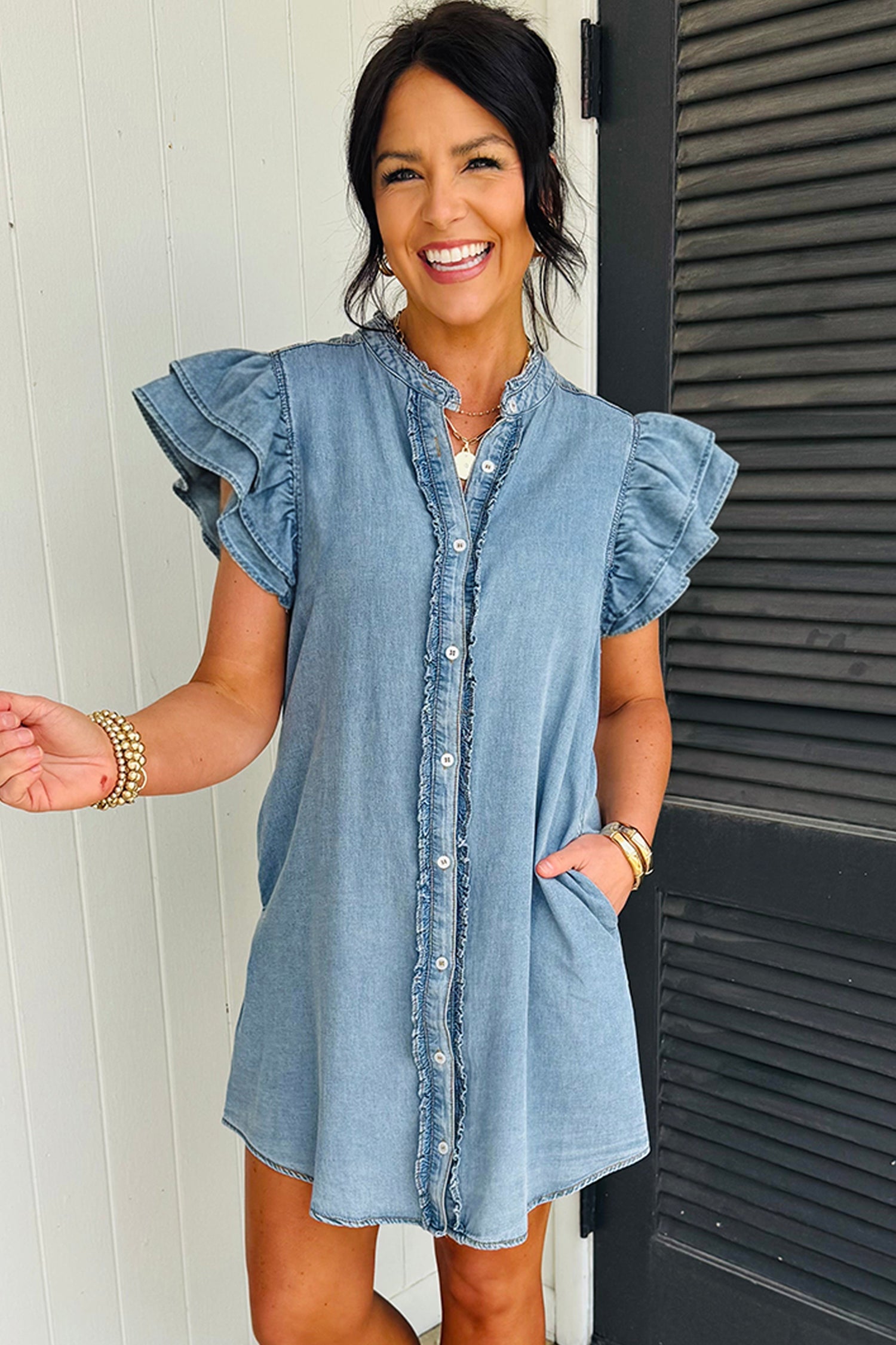 Light blue Sasha short sleeve mini dress by Threaded Pear, featuring a fitted bodice and flared skirt, displayed on a hanger.