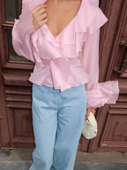 Women's elegant long sleeve blouse with ruffle trim made from soft Tencel blend, stylish and comfortable for any occasion.