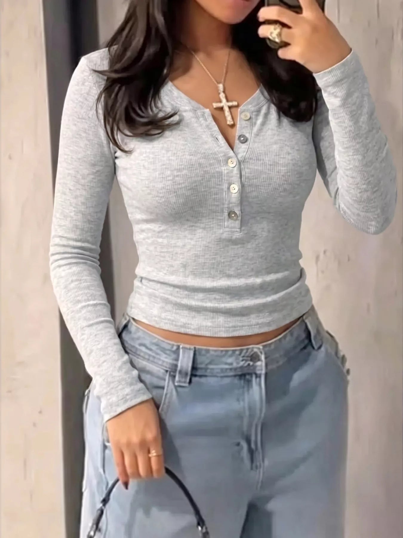 Long sleeve T-shirt with button details in plush fabric by Plush Fashion Hub, featuring a comfortable fit and stylish design.