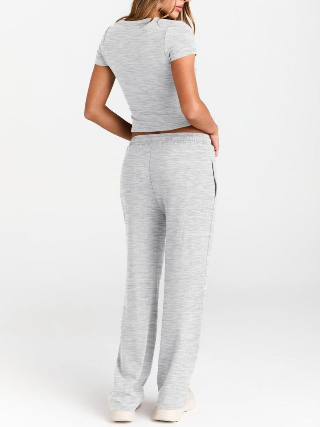 Women's round neck short sleeve T-shirt and drawstring lounge set by Trendsi, with soft fabric and relaxed fit in the image.