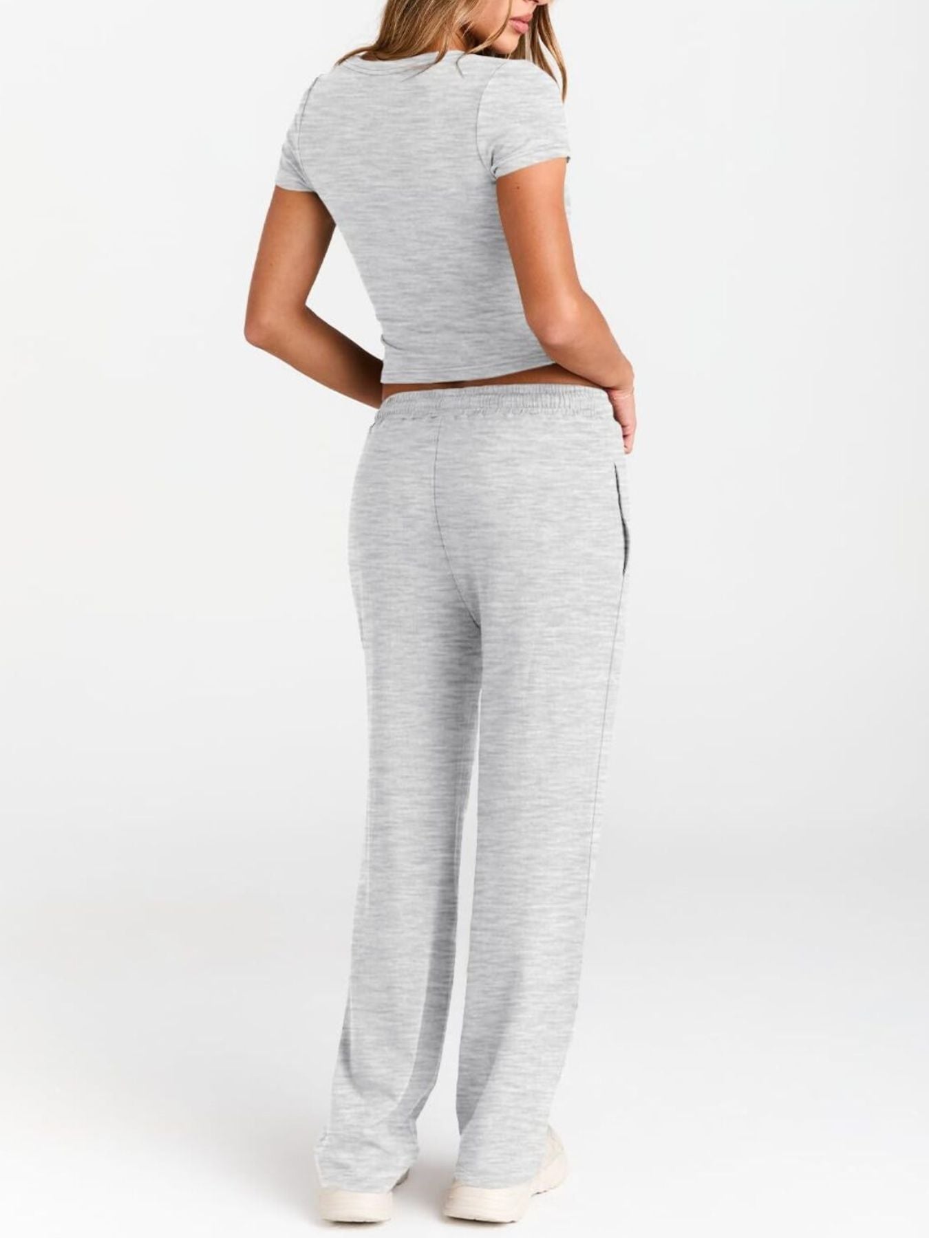 Women's round neck short sleeve T-shirt and drawstring lounge set by Trendsi, with soft fabric and relaxed fit in the image.