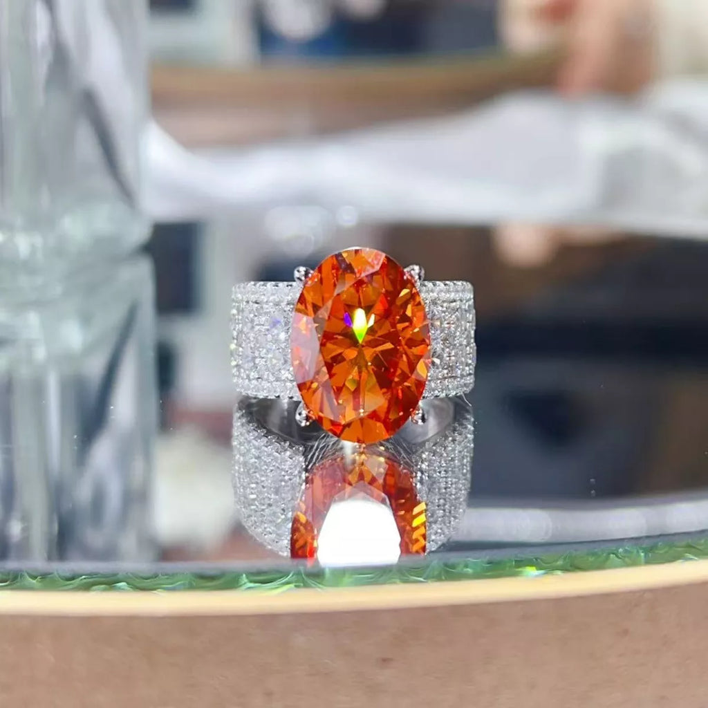 Sterling silver ring with an 8-carat moissanite gemstone, showcasing a sparkling center stone and intricate band design.