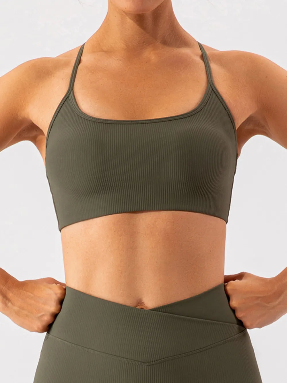 Trendsi spaghetti strap active bra in black, lightweight and stretchy, designed for comfortable workouts and active wear.