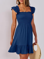 Women's smocked ruffle hem mini dress by Trendsi, casual lightweight summer dress with a flowy silhouette and ruffle details.