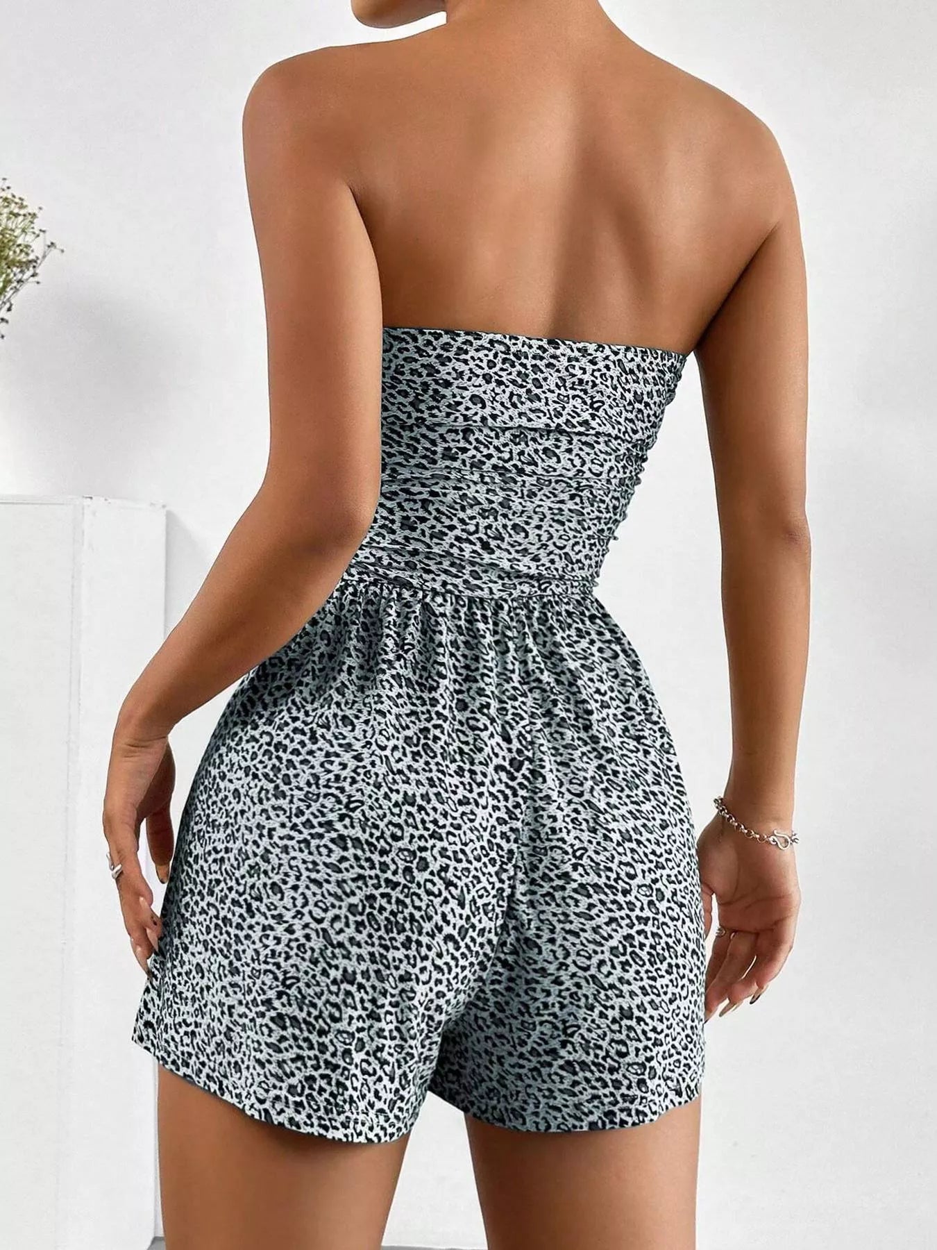 Chic strapless romper with ruched waist by Trendsi, featuring a stylish and fitted design perfect for warm weather.